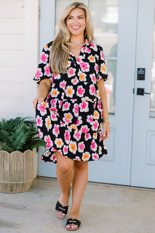 Chic Soul plus size clothing, black short sleeve tiered mini dress with v neckline and puff sleeves with large orange and pink floral pattern