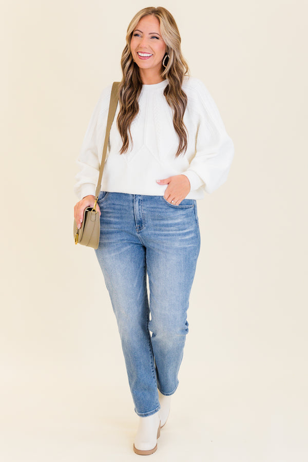 mid-waisted medium-wash straight-leg cropped denim jeans with silver button detailing 
