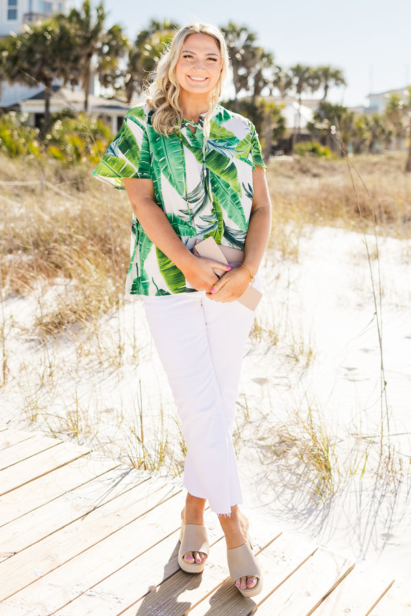 Chic Soul plus size clothing, Short sleeve white casual top with a leaf pattern and s light v-neck with a draw-string detail
