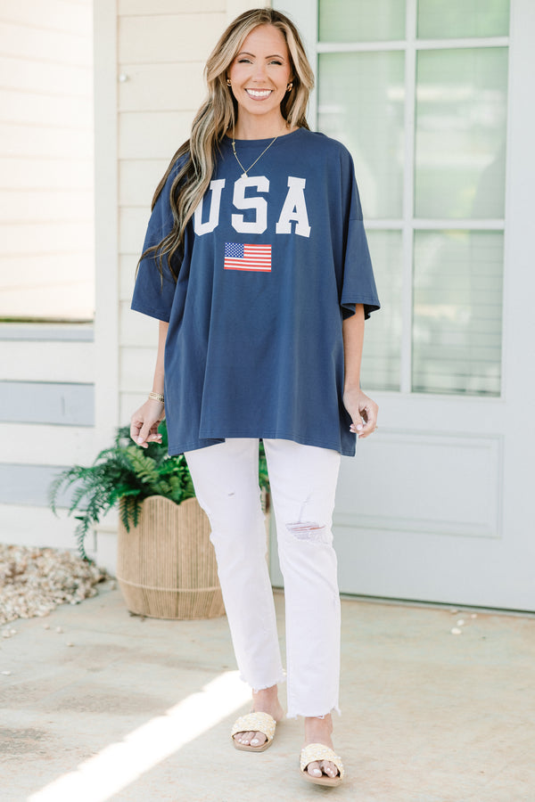 Plus Size navy blue oversized boyfriend tee with white USA text and an American flag graphic. 