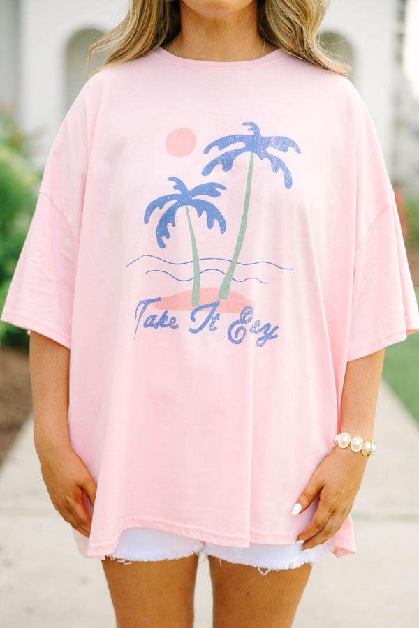Plus Size dusty pink oversized boyfriend tee with a palm tree graphic and white denim shorts.