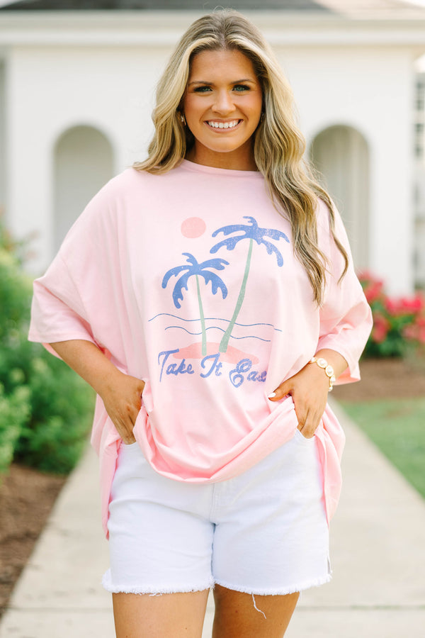 Plus Size dusty pink oversized boyfriend tee with a palm tree graphic and white denim shorts.
