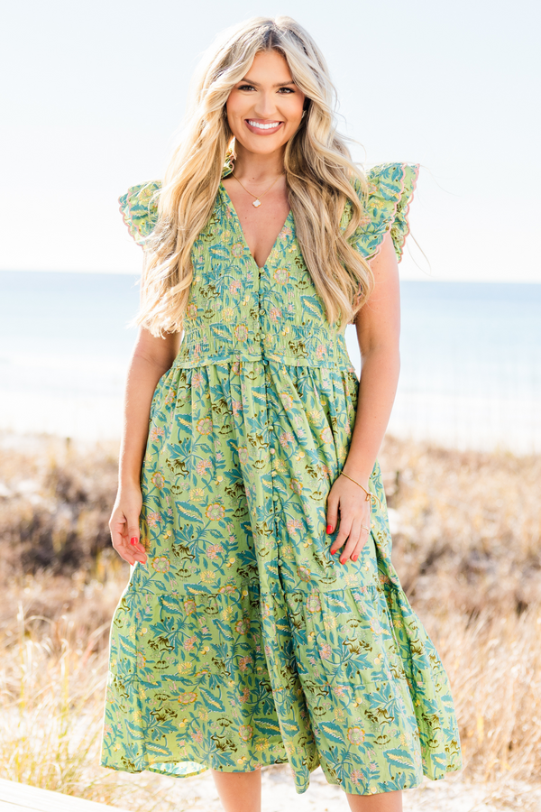 Chic Soul plus size clothing, short-flutter-sleeve green midi dress with a smocked bodice and a tiered skirt with a buttoned detailing down the front and a pink ric rac piping with a green tropical floral print pattern