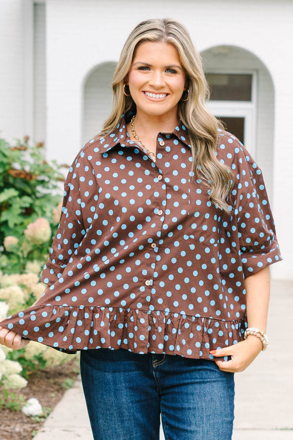 Plus Size brown button-down top with blue polka dots, short sleeves, and a ruffled hem.