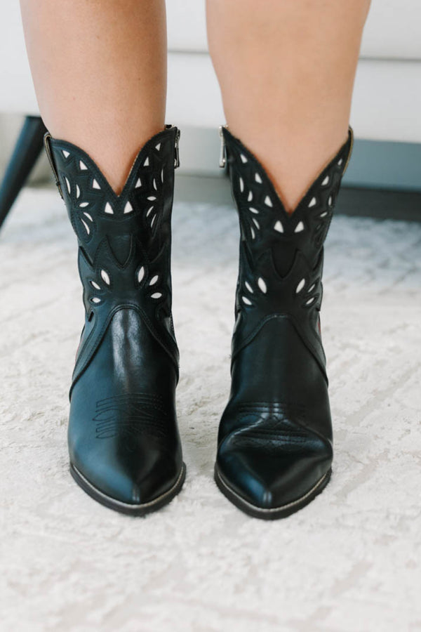 Plus size black western booties with white cutout details, red piping, and a stacked block heel.