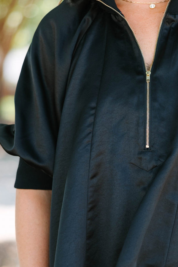 Plus Size black satin-finish top with a half-zip neckline, high collar, and short puff sleeves.