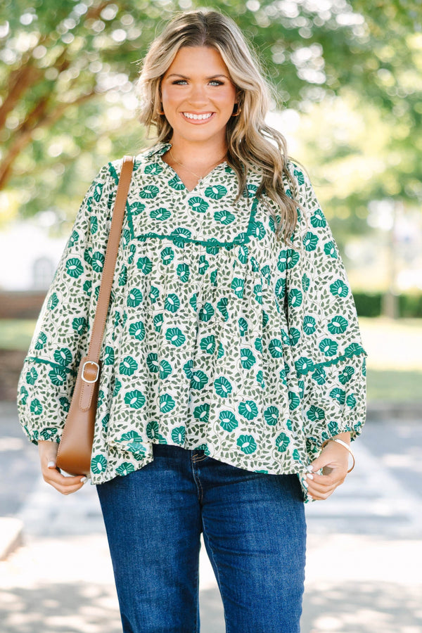 Plus Size green floral print top with long sleeves, a V-neckline, and a loose, flowy fit.