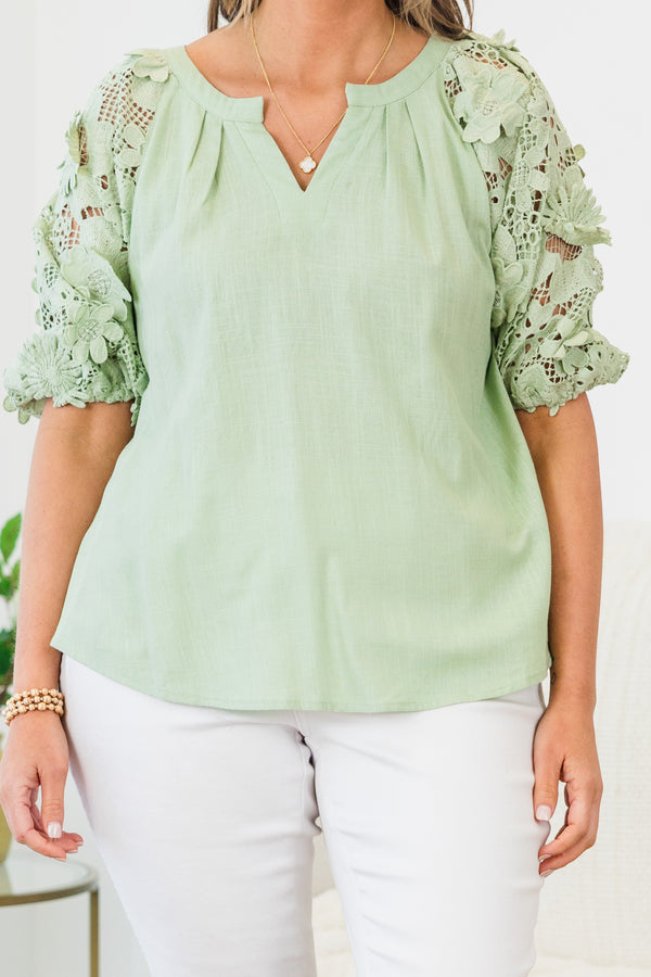 Chic Soul plus size clothing, short-puffed-sleeve sage green top with a split-v-neckline and floral lace detailing along the sleeve