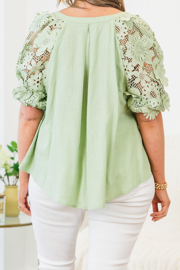 Chic Soul plus size clothing, short-puffed-sleeve sage green top with a split-v-neckline and floral lace detailing along the sleeve
