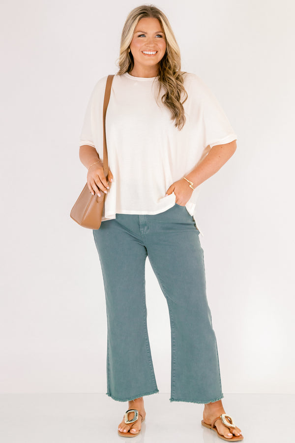 Chic Soul plus size clothing, teal bootcut jeans with front pockets and fringe details at the end of each pant leg
