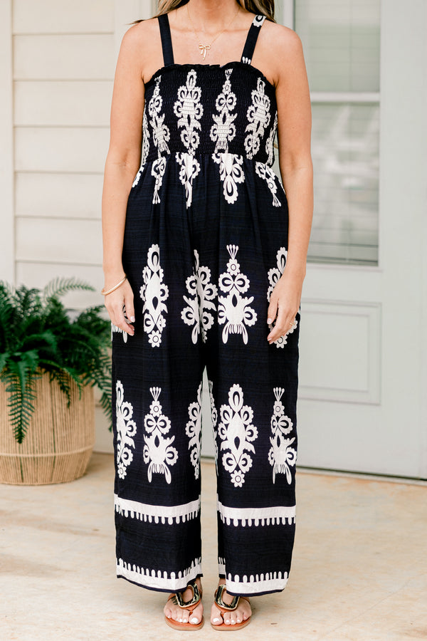 Chic Soul plus size clothing, sleeveless spaghetti strap navy wide leg jumpsuit with a white paisley pattern 