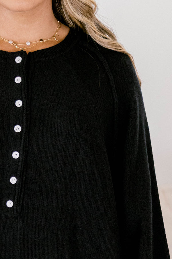 Chic Soul plus size clothing, black sweater with long bubble sleeves and white buttons going down to the chest area 