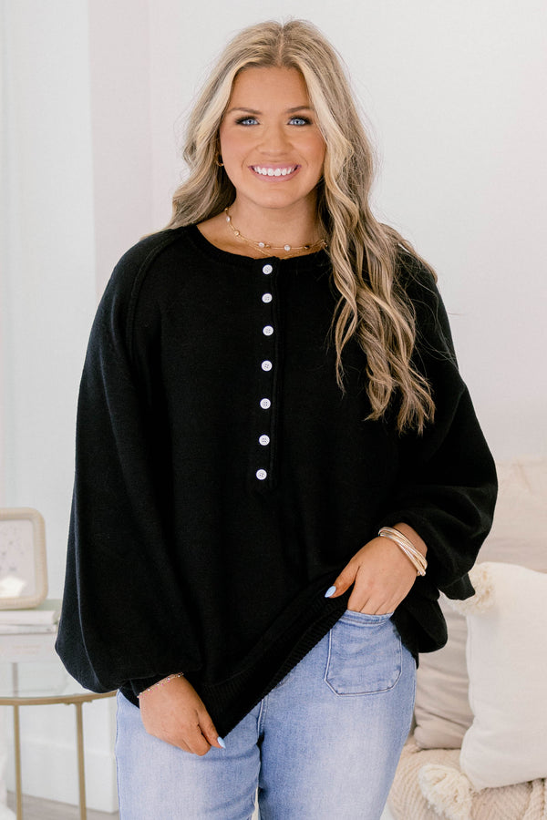 Chic Soul plus size clothing, black sweater with long bubble sleeves and white buttons going down to the chest area 