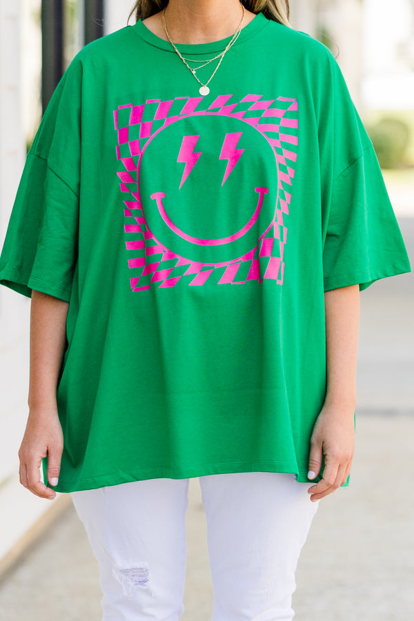 Plus Size oversized evergreen boyfriend tee with a pink lightning bolt smiley face graphic.
