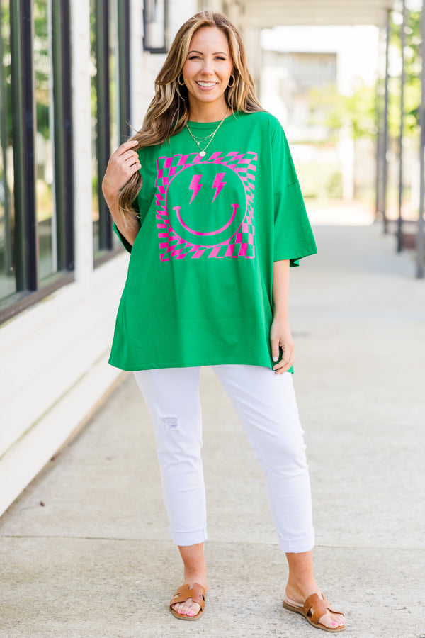 Plus Size oversized evergreen boyfriend tee with a pink lightning bolt smiley face graphic.