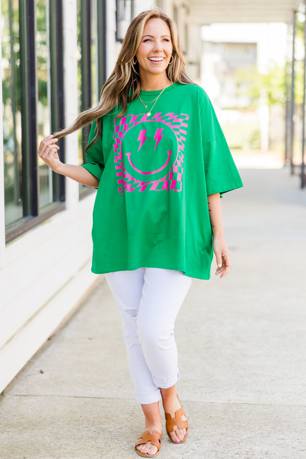 Plus Size oversized evergreen boyfriend tee with a pink lightning bolt smiley face graphic.