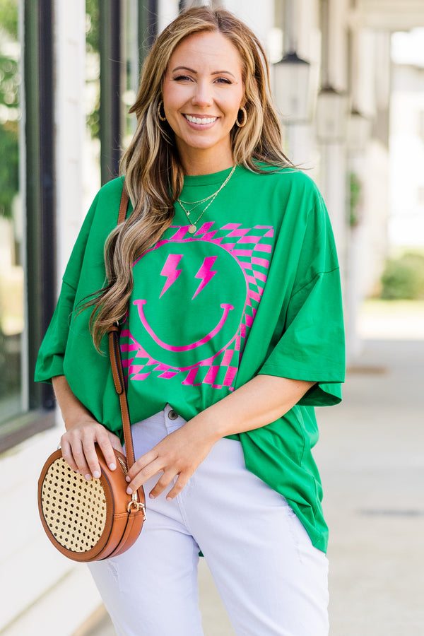 Plus Size oversized evergreen boyfriend tee with a pink lightning bolt smiley face graphic.