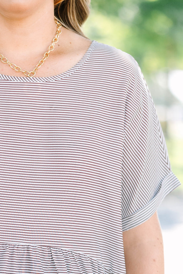 Plus size brown and ivory striped flowy top with a relaxed fit and short flutter sleeves.