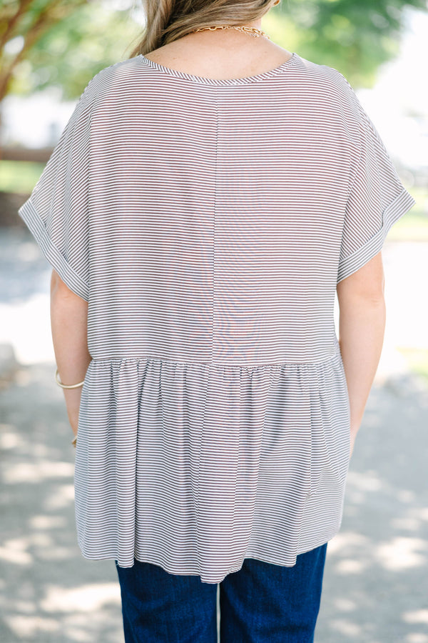 Plus size brown and ivory striped flowy top with a relaxed fit and short flutter sleeves.