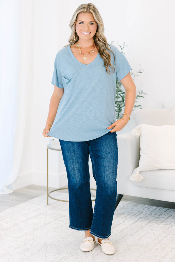 Plus Size dusty blue v-neck top with a relaxed fit, short sleeves, and a front chest pocket.