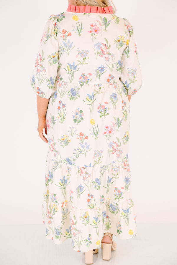 Chic Soul plus size clothing, cream maxi dress with half bubble sleeves along with a pink strip ruffle detail going along the v-neckline and a multi-colored floral pattern throughout