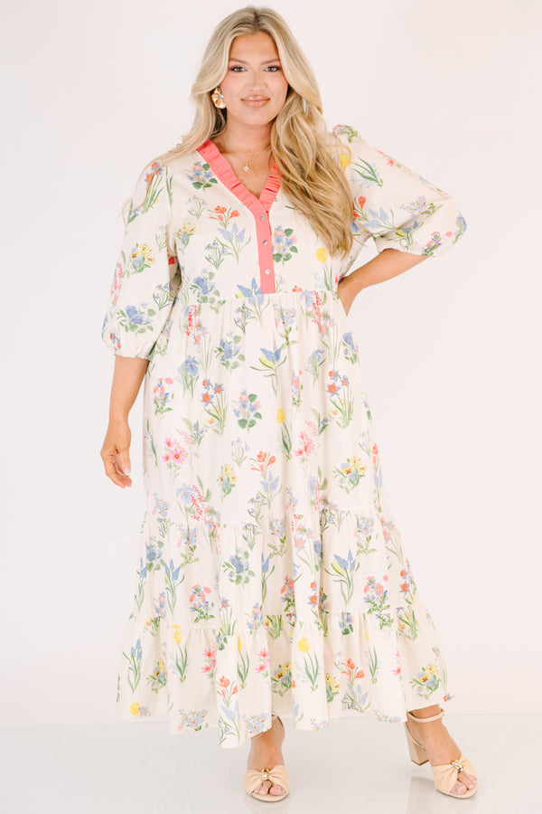 Chic Soul plus size clothing, cream maxi dress with half bubble sleeves along with a pink strip ruffle detail going along the v-neckline and a multi-colored floral pattern throughout