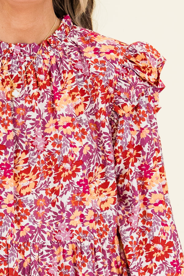 Chic Soul plus size clothing, long-sleeve maroon ruffled baby doll dress with smocked neckline and ruffled detailing on shoulders with abstract orange and maroon floral paisley pattern