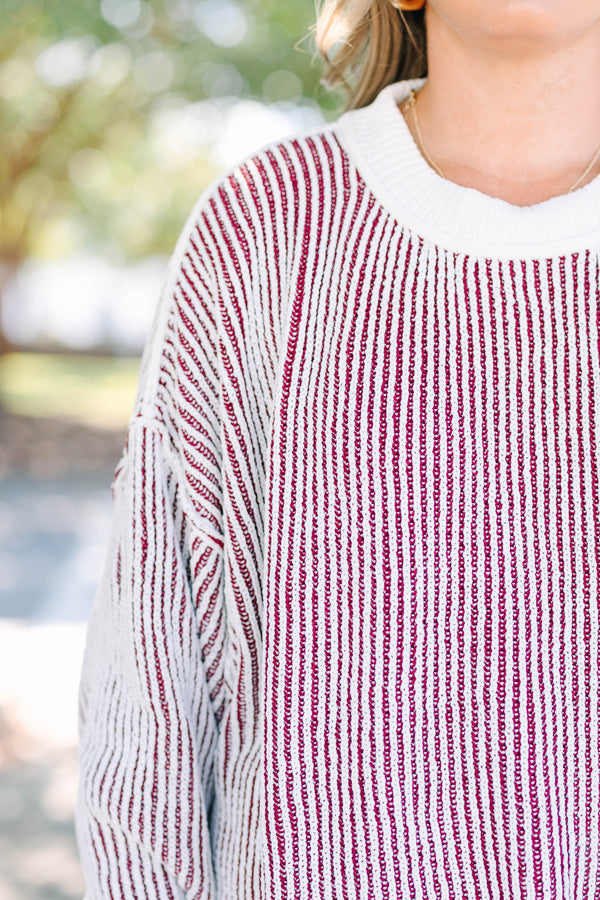 Plus Size cabernet and white striped knit sweater with a crew neckline and ribbed trim.