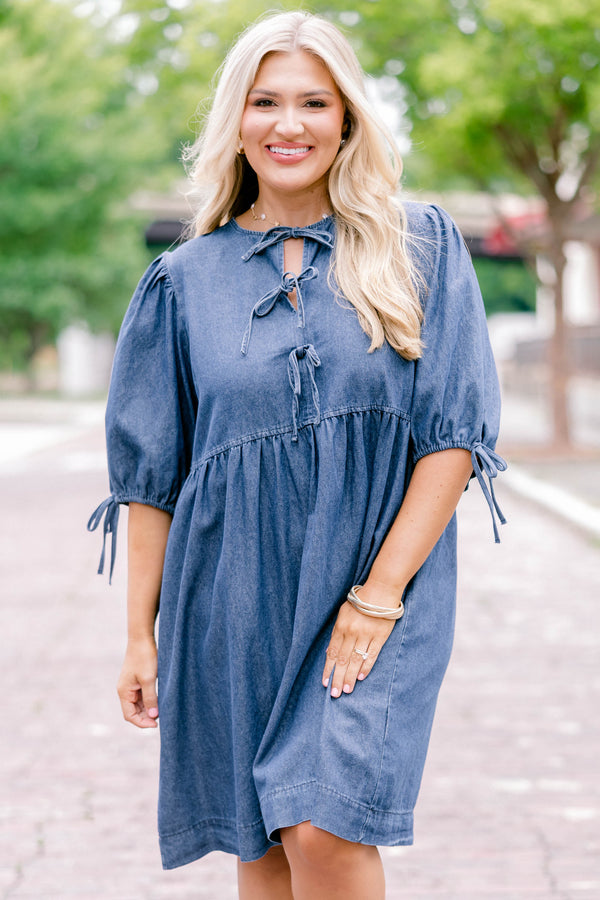 Chic Soul plus size clothing, denim blue short-sleeve short dress that has sleeves tied with bows and a bow tied detailing on the top