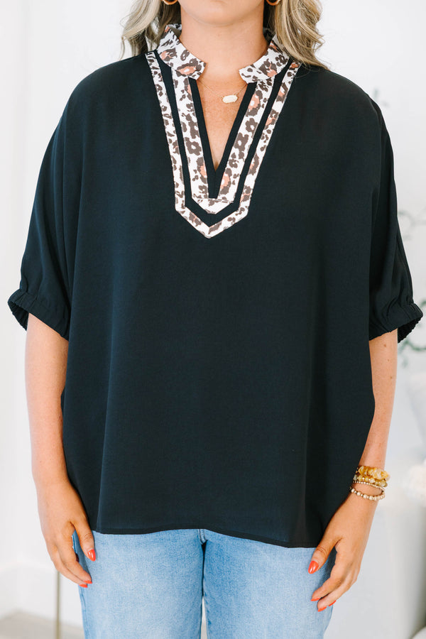 Plus Size black short dolman sleeve top with a leopard print split v-neckline trim.