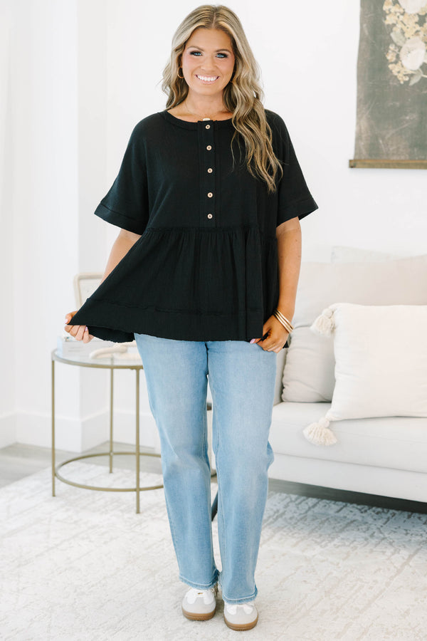 Plus size black cotton-blend babydoll top with button-front detail and a flowy tiered silhouette.