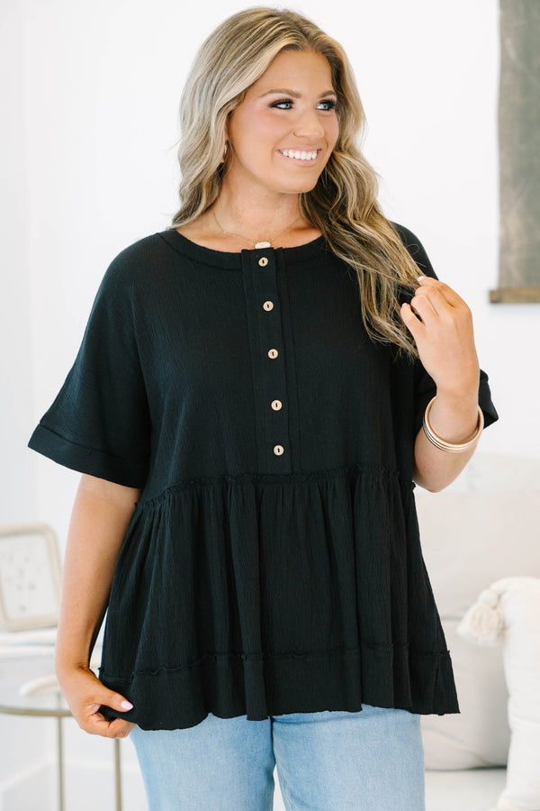 Plus size black cotton-blend babydoll top with button-front detail and a flowy tiered silhouette.