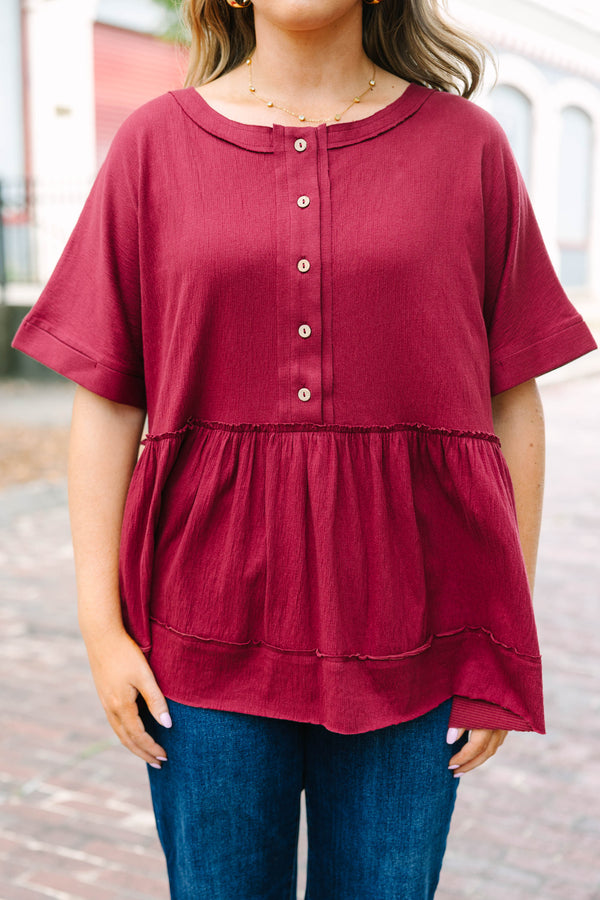 Plus Size burgundy babydoll top with functional front buttons and tacked cuff sleeves.