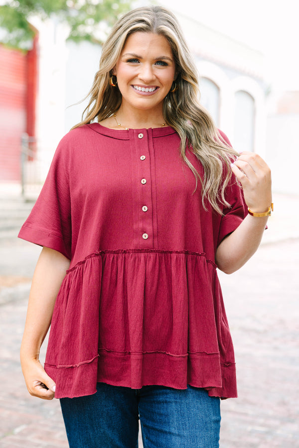 Plus Size burgundy babydoll top with functional front buttons and tacked cuff sleeves.