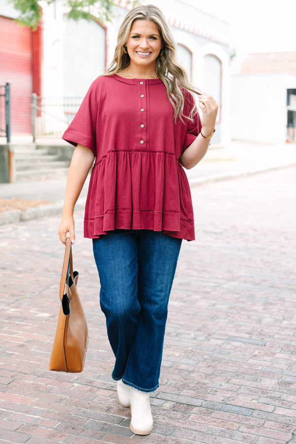 Plus Size burgundy babydoll top with functional front buttons and tacked cuff sleeves.