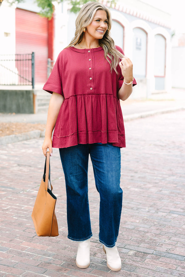 Plus Size burgundy babydoll top with functional front buttons and tacked cuff sleeves.