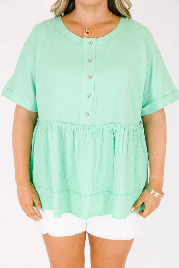 Chic Soul plus size clothing, short-sleeve vibrant green baby doll top with a high-scoop-neckline and brown button detailing with subtle distressed detailing 