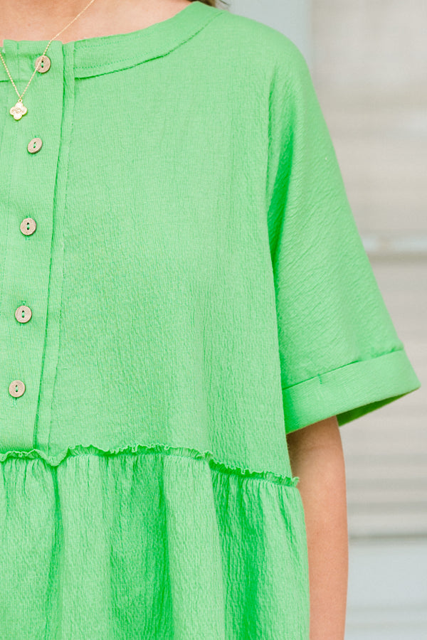 Chic Soul plus size clothing, short-sleeve vibrant green baby doll top with a high-scoop-neckline and brown button detailing with subtle distressed detailing 
