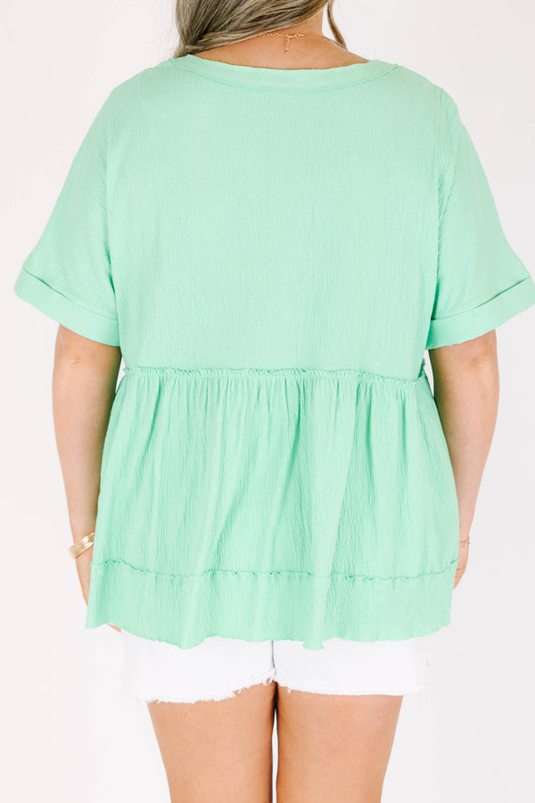 Chic Soul plus size clothing, short-sleeve vibrant green baby doll top with a high-scoop-neckline and brown button detailing with subtle distressed detailing 