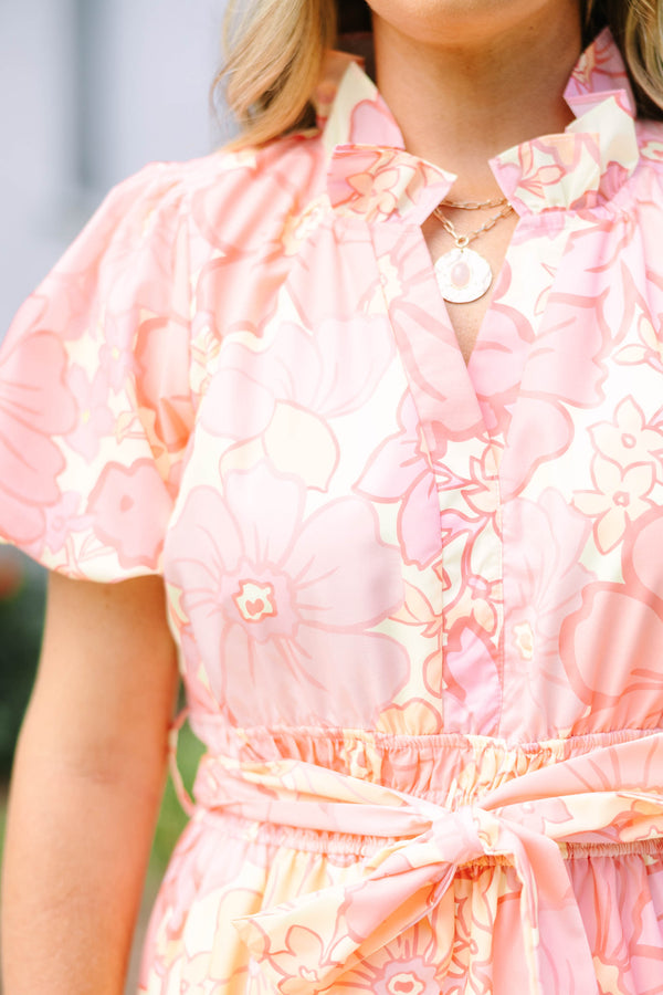 Plus Size pink floral maxi dress with short puff sleeves, a belted waist, and tiered skirt.