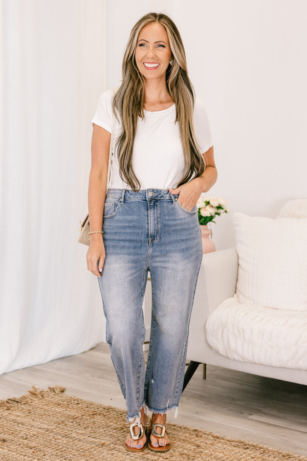 Chic Soul plus size clothing, high-waisted light wash straight leg cropped denim jeans with a distressed frayed hem and a silver button detailing 