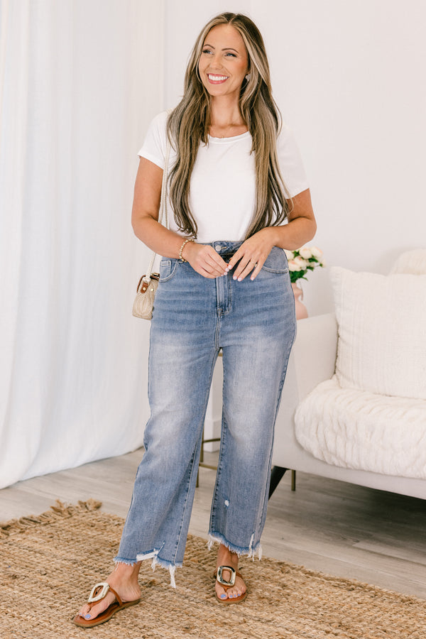 Chic Soul plus size clothing, high-waisted light wash straight leg cropped denim jeans with a distressed frayed hem and a silver button detailing 