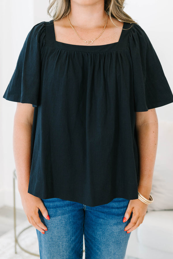 Plus size black cotton top with breezy bell sleeves and a modern square neckline.