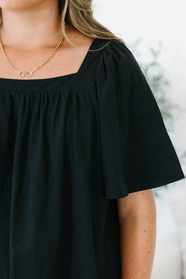 Plus size black cotton top with breezy bell sleeves and a modern square neckline.