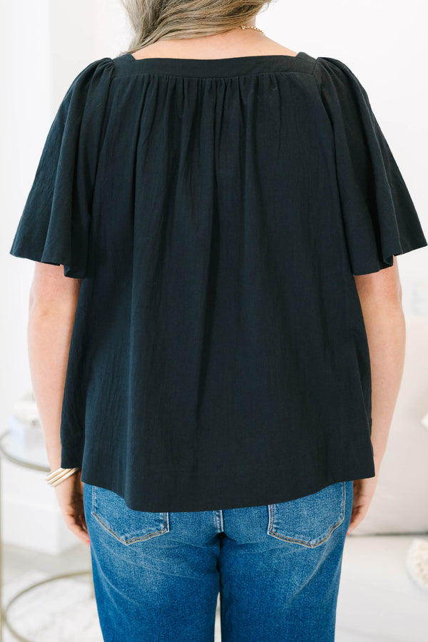 Plus size black cotton top with breezy bell sleeves and a modern square neckline.