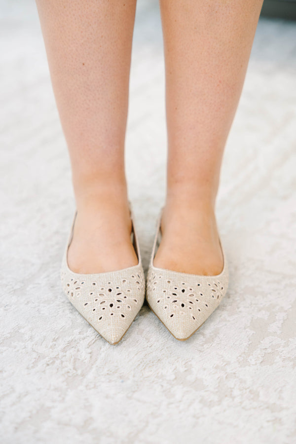 Natural pointed-toe slingback flats with delicate eyelet embroidery and a comfortable low heel.