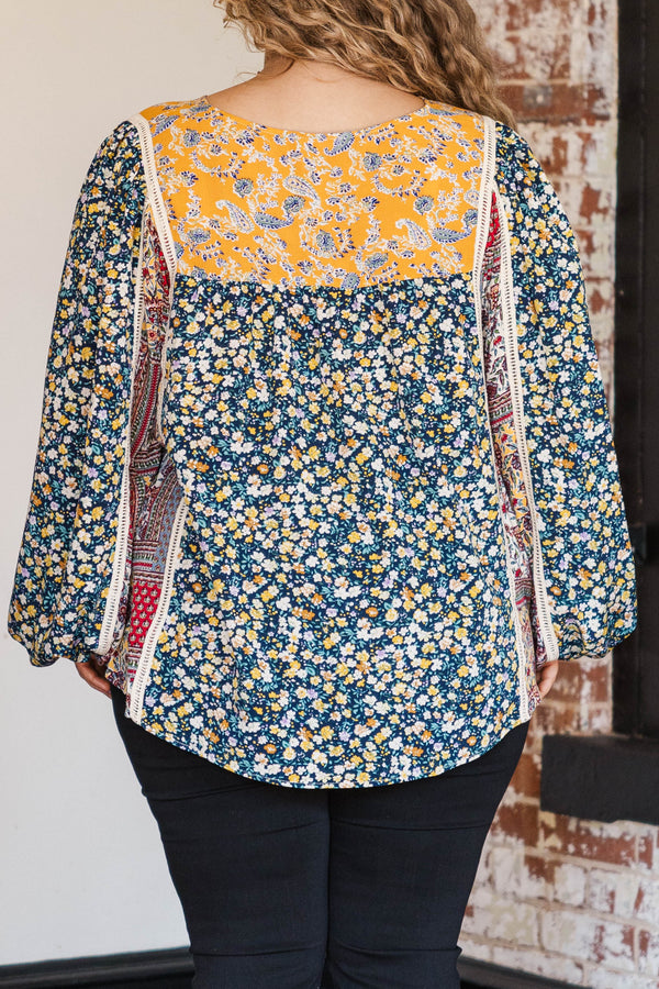 Chic Soul plus size clothing, navy colored base long sleeve top with multi prints orange florals and red bandana style pattern at inner sides of sleeves and orange colored around neckline and lace bodice structure
