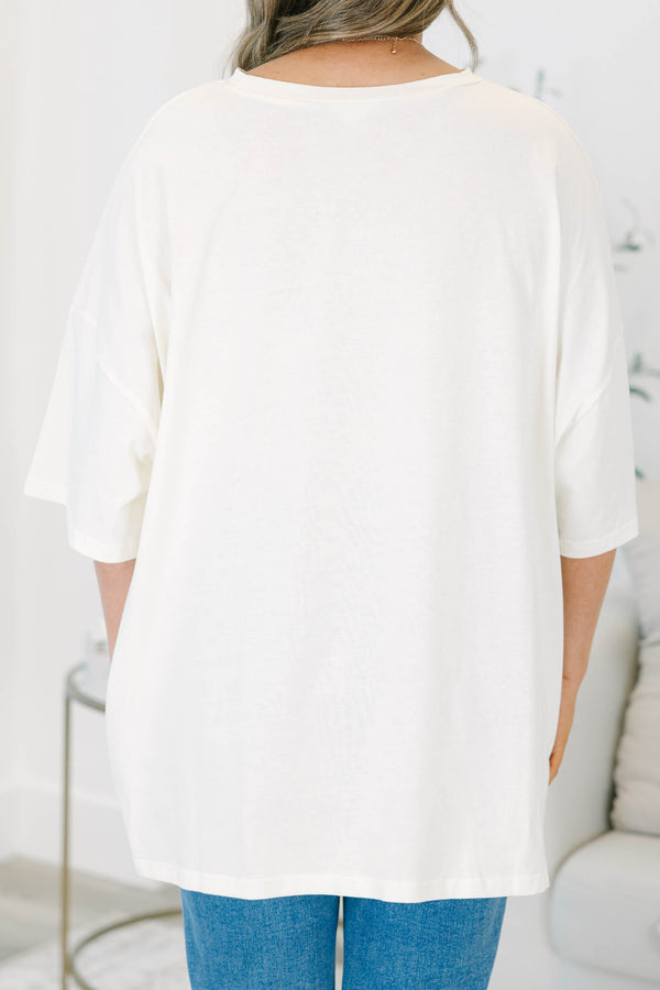 Plus size ivory boyfriend tee with a 'Trick or Treat' graphic, featuring a flowy, oversized fit.