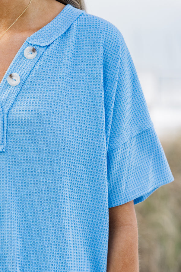 Chic Soul plus size clothing, ocean blue short sleeve top with a three buttons on the v-neckline and a waffle textured pattern 
