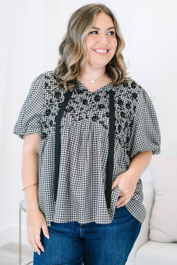 Plus Size black and white gingham top with floral embroidery, puff sleeves, and black ribbon ties.